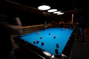 a pool table in a bar with balls on it at Apartments Popadić with parking in Herceg-Novi