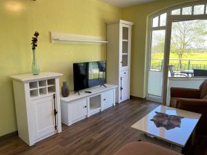 TV a/nebo společenská místnost v ubytování Apartment Tulpe by Interhome