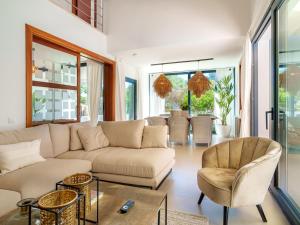 a living room with a couch and chairs at Villa Can Aruna by Interhome in Colonia de Sant Pere