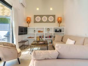 a living room with a couch and a table at Villa Can Aruna by Interhome in Colonia de Sant Pere +32 photos