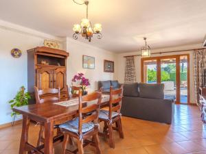 a living room with a table and a couch at Villa Ca na Fideu by Interhome in Alcudia