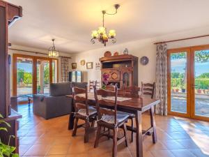 a dining room with a table and chairs at Villa Ca na Fideu by Interhome in Alcudia