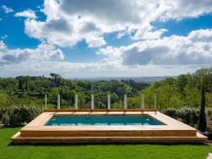 a swimming pool in the yard of a house at Apartment Cinzia by Interhome in Santa Maria a Monte
