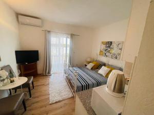 TV a/nebo společenská místnost v ubytování Apartments Esperanza