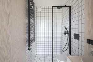 a bathroom with a shower and a sink at Vanduo Marse in Tuliejai +36 photos
