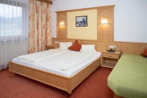 Ένα ή περισσότερα κρεβάτια σε δωμάτιο στο Hotel Waidachhof