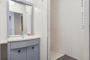 a bathroom with a sink and a mirror at Charming apt for 5 people in Paris by Weekome in Paris