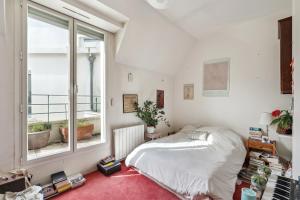 Katil atau katil-katil dalam bilik di Charming apt for 5 people in Paris by Weekome