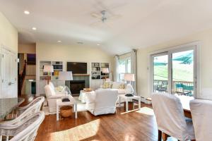 a living room with white furniture and a fireplace at Old Litchfield, Washington CT in Washington