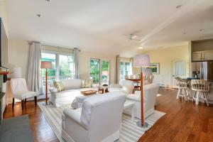 a living room with white furniture and a table at Old Litchfield, Washington CT in Washington