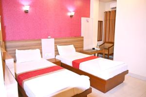 Postel nebo postele na pokoji v ubytování HOTEL PERFECT PLAZA
