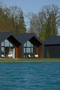 a rendering of a house next to the water at Vanduo Marse in Tuliejai