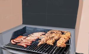 a bunch of sausages and chicken cooking on a grill at Beb da Gaia e Giulio in Reno Di Leggiuno