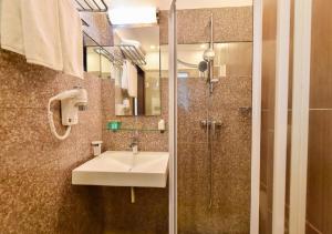 Koupelna v ubytování Hotel Scapino