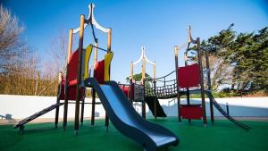 a playground with a slide in a park at Newquay Caravan, Newquay Bay Resort Jetts View 104 in Newquay