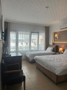 Postel nebo postele na pokoji v ubytování Hotel Stella