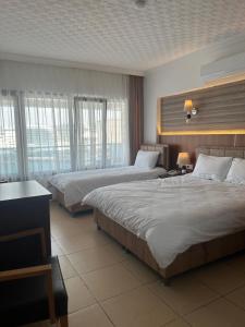 Postel nebo postele na pokoji v ubytování Hotel Stella