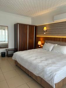 Postel nebo postele na pokoji v ubytování Hotel Stella