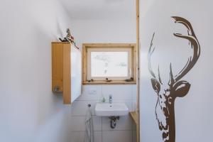 Koupelna v ubytování Guggis boarding Fewo inkl Büro + 37 fotografií