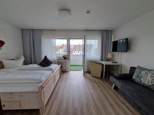 Postel nebo postele na pokoji v ubytování Apart Hotel Freiburg