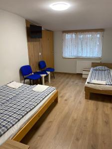 Postel nebo postele na pokoji v ubytování Rezydencja pod Gwiazdami