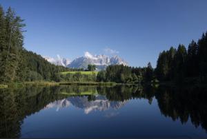 a view of a lake with mountains in the background at Apartment 1919 in Kitzbühel