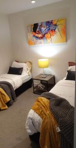 Postel nebo postele na pokoji v ubytování Urban Eden in South Yarra
