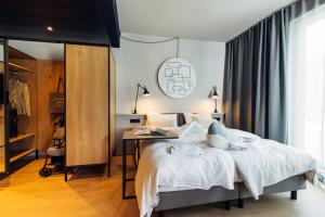 Postel nebo postele na pokoji v ubytování harry's home Zürich-Limmattal