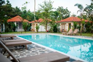 a villa with a swimming pool in a resort at Panta Rei resort in Ahangama