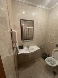 a bathroom with a sink and a toilet at Santa Marina Holiday Village Studio Iskra in Sozopol