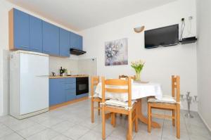 Kuchyň nebo kuchyňský kout v ubytování Apartments Sandy