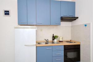 Kuchyň nebo kuchyňský kout v ubytování Apartments Sandy