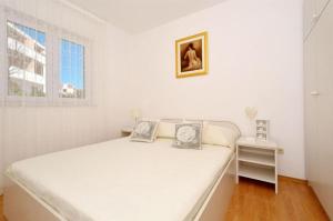 Postel nebo postele na pokoji v ubytování Apartments Sandy