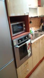 a kitchen with a microwave and an oven at Katties nice studio in Stara Zagora