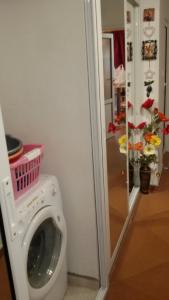 a washing machine with a basket on top of it at Katties nice studio in Stara Zagora