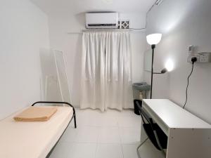 a white room with a bed and a window at Tiong Nam 32, Heart of Kuala Lumpur, 15mins to KLCC, 6 mins to LRT PWTC in Kuala Lumpur +26 photos