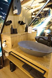 a bathroom with a large tub on a wooden counter at Zinsers Appartements im Flämmle 