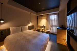 Postel nebo postele na pokoji v ubytování Hotel Resol Trinity Osaka