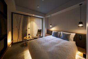 Postel nebo postele na pokoji v ubytování Hotel Resol Trinity Osaka