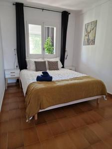 Postel nebo postele na pokoji v ubytování Sant Gaieta H
