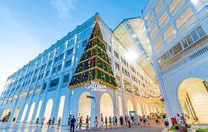 a christmas tree in the middle of a building at Lux 3BR max 25pax Projector 160inch Netflix Iskandar Puteri near Legoland in Kangkar Pendas