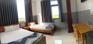 Postelja oz. postelje v sobi nastanitve Hotel Sen Việt Bạc Liêu