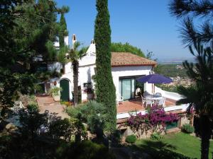 a villa with a view of a garden at Ibiza in Begur