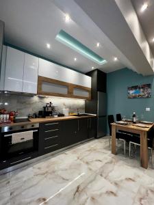 a large kitchen with a table and a dining room at Diamond in Thessaloniki
