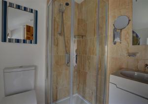 a bathroom with a shower and a toilet and a sink at 3 Bed in Croyde oc-beren in Croyde +36 photos