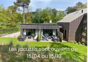 a person sitting on a couch in front of a house at Les Tchanquées in Le Touquet-Paris-Plage