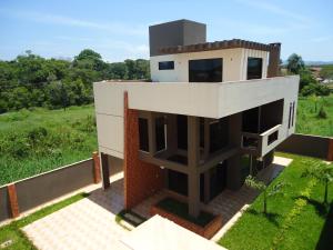 a rendering of a house on a hill at Triplex de veraneio em Guaratuba in Guaratuba