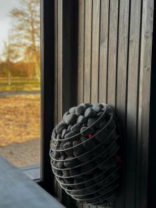 a vase sitting on the side of a window at Ragnar Glamp Pitrags Lux PREMIUM in Pitragutsiyeme