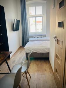 Łóżko lub łóżka w pokoju w obiekcie Narutowicza 5 Apartments