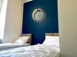 Łóżko lub łóżka w pokoju w obiekcie Narutowicza 5 Apartments